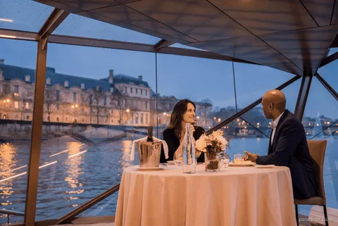 Bateaux Mouches dinner cruise restaurant boat on the Seine River at night