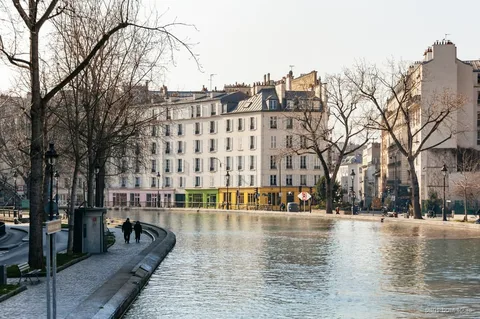 Boat passing through the Saint-Martin Canal tunnel in Paris